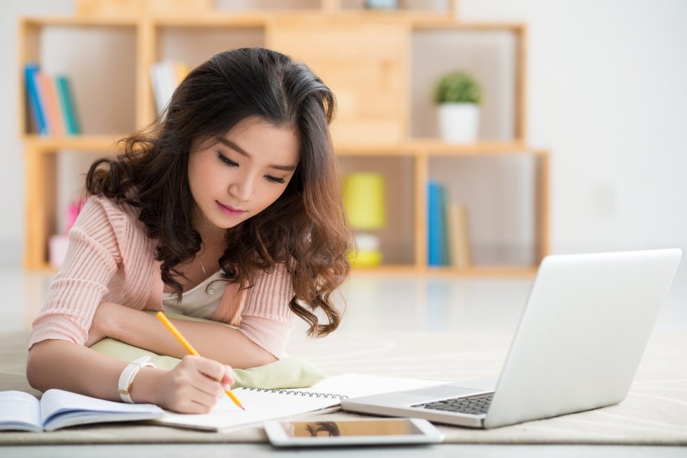 A student studying at her laptop