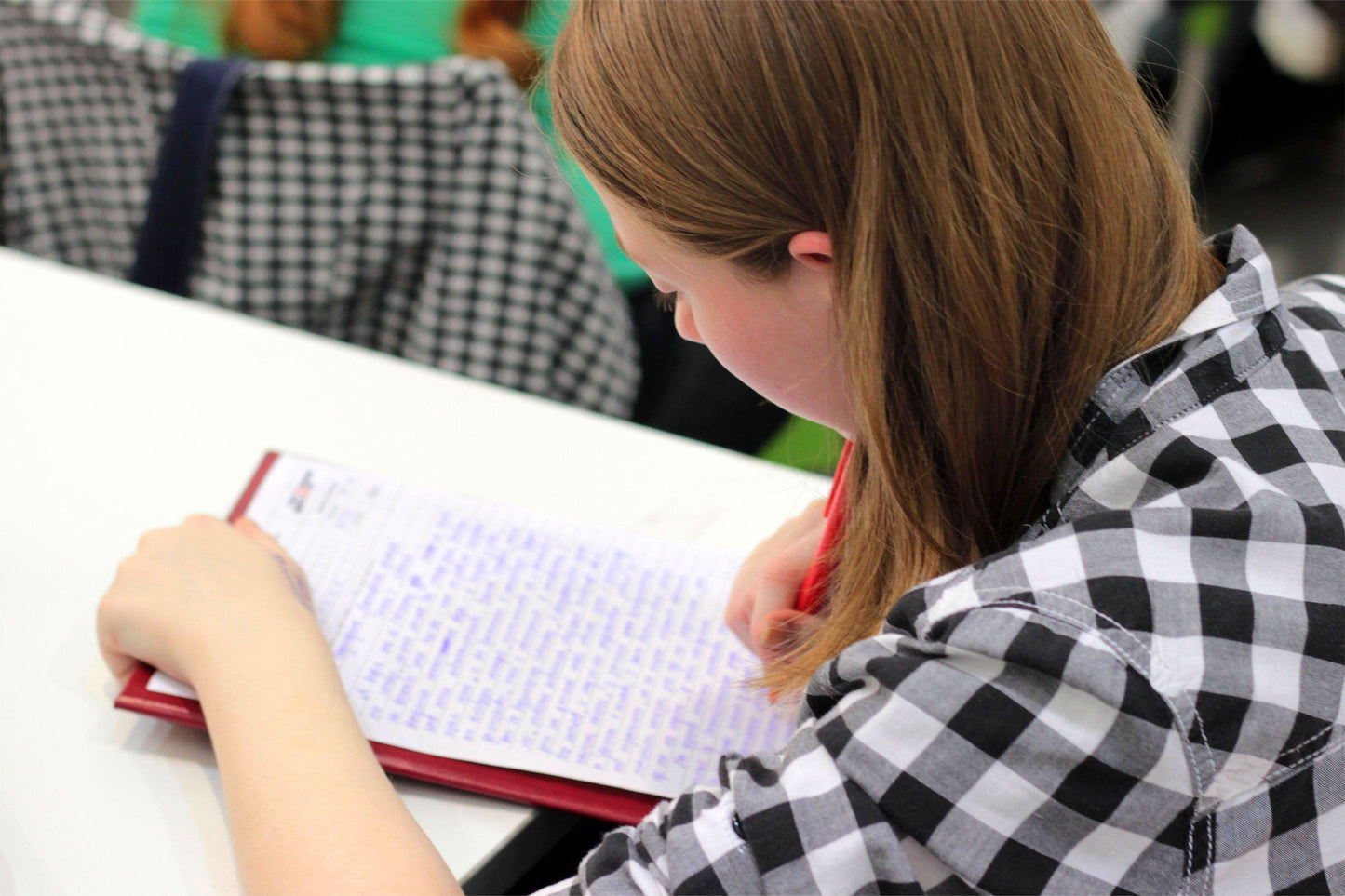 Girl writing in her notebook