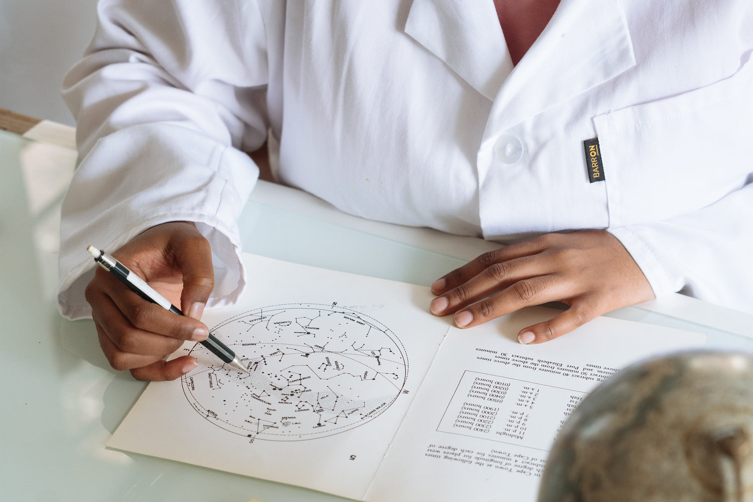 A person writing in a notebook