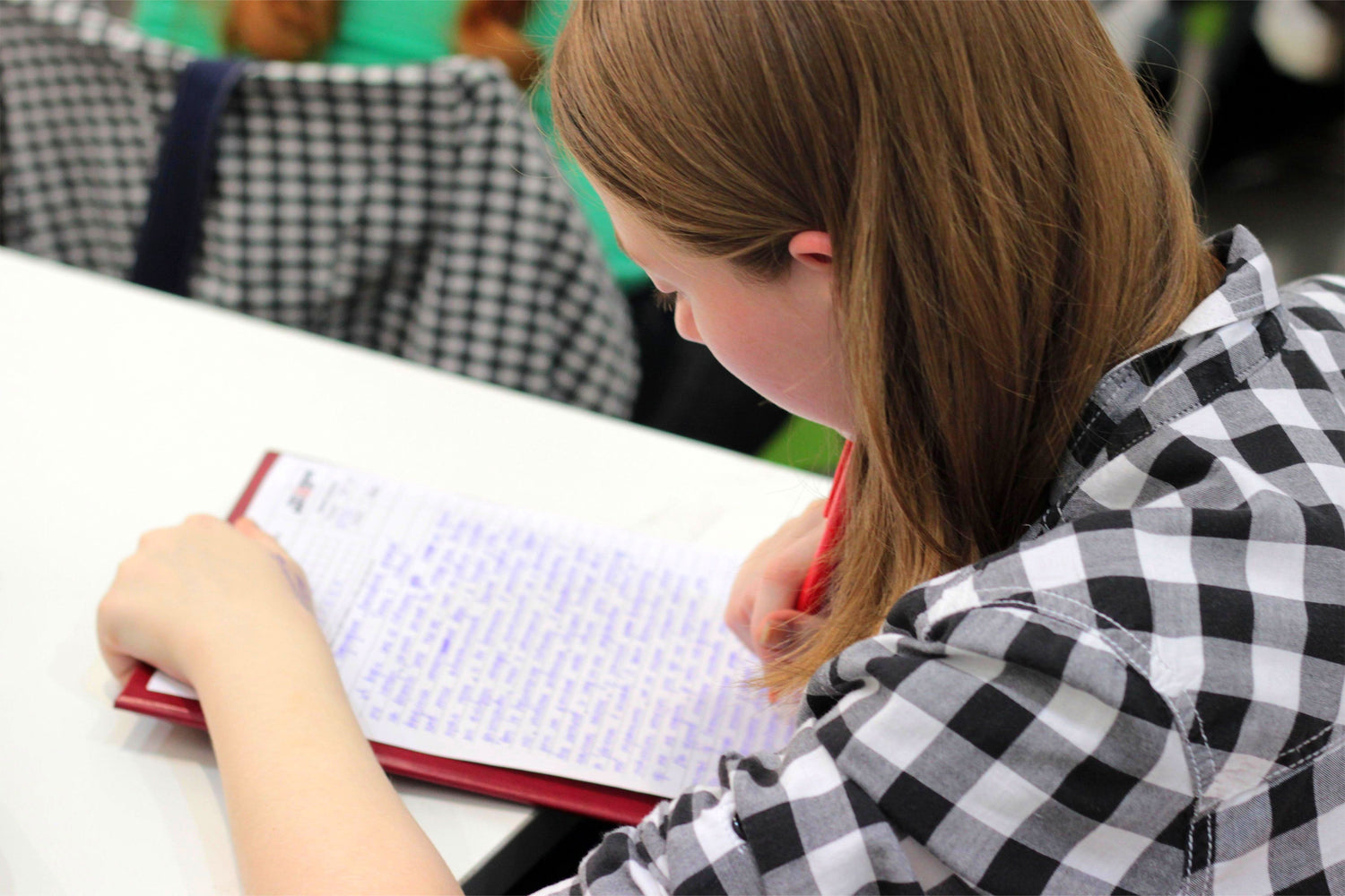 Girl writing in her notebook